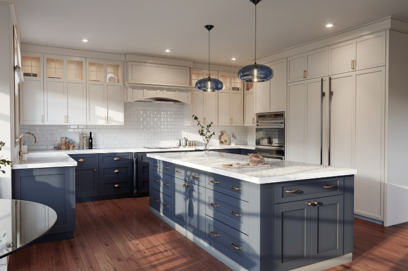 Modern kitchen with white upper cabinets, blue lower cabinets and island, marble countertops, stainless steel appliances, wood flooring, pendant lights, and glass cabinet accents. Fresh and clean design with ample lighting.